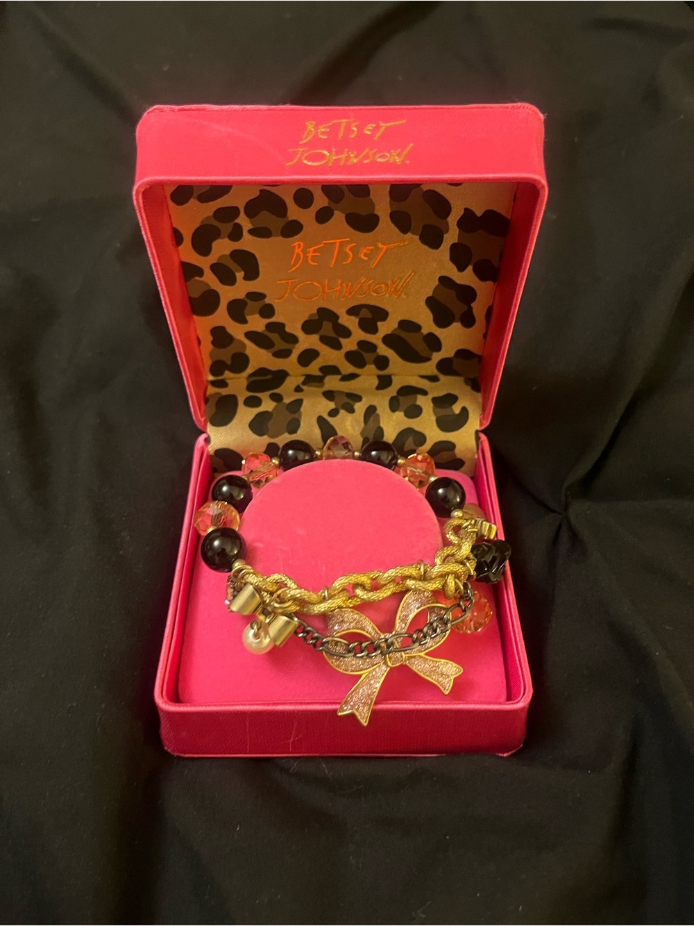Betsey Johnson Gold and Black Bow Charm Bracelet in Pink Box